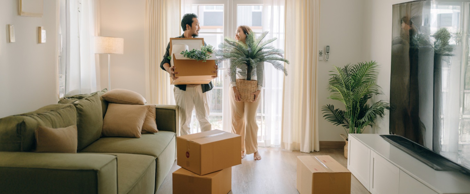 a couple moving into their new residence