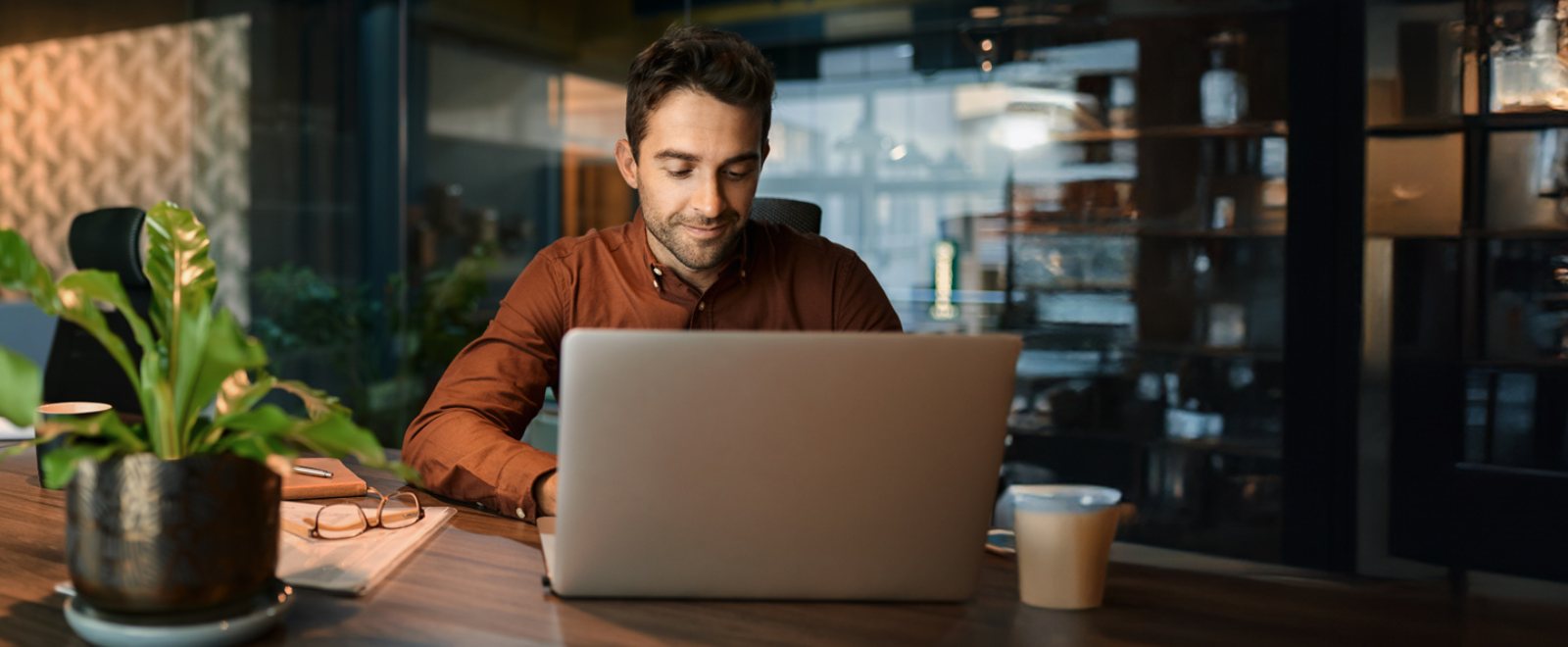 a man working on his laptop computer